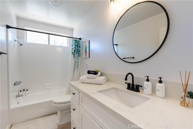 full bathroom featuring toilet, shower / tub combo, and vanity