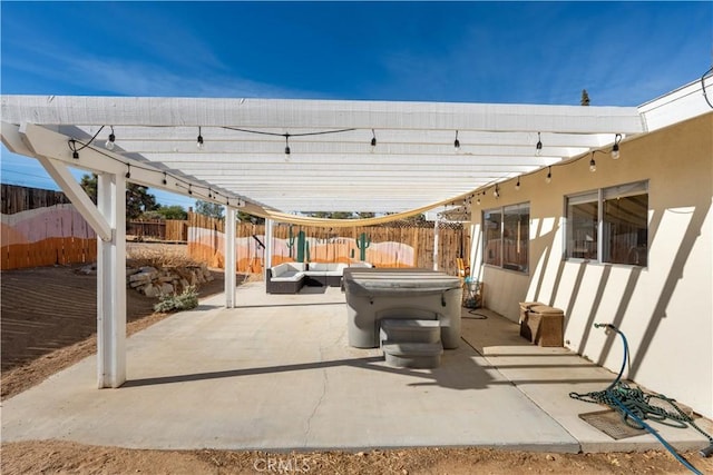 view of patio with an outdoor hangout area and a hot tub