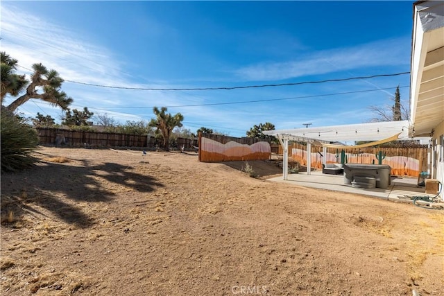 view of yard featuring a pergola, a jacuzzi, and a patio