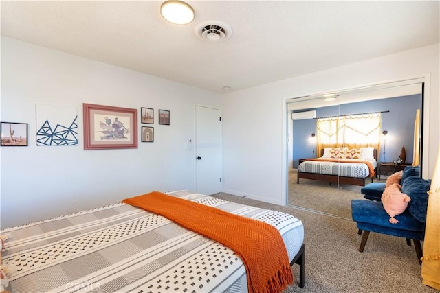 58387 Carlyle Dr, Yucca Valley, CA 92284 - bedroom with carpet floors, baseboards, a wall unit AC, and visible vents