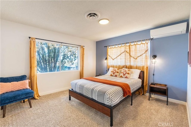 bedroom featuring carpet and a wall mounted AC