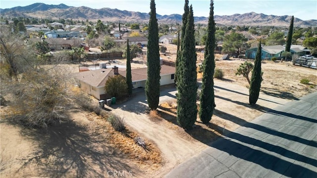 birds eye view of property with a mountain view