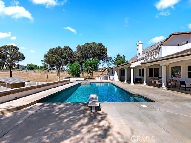 outdoor pool with a patio