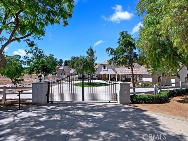 view of gate featuring fence