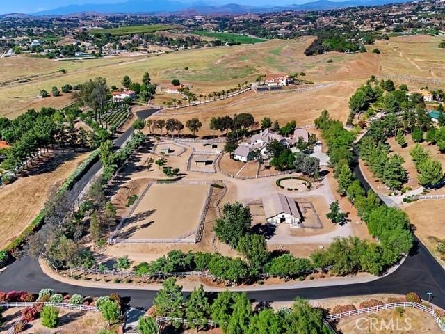 birds eye view of property with a rural view