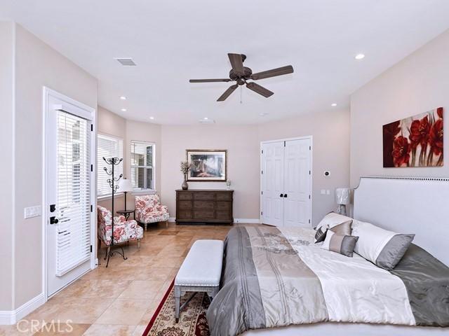 bedroom with baseboards, light tile patterned floors, recessed lighting, a closet, and a ceiling fan