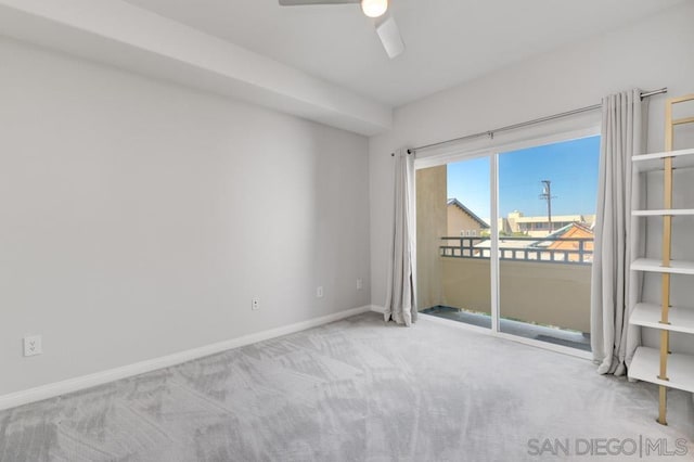 carpeted empty room with ceiling fan