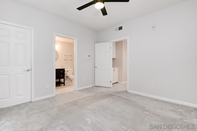 unfurnished bedroom featuring ensuite bathroom, ceiling fan, and light carpet