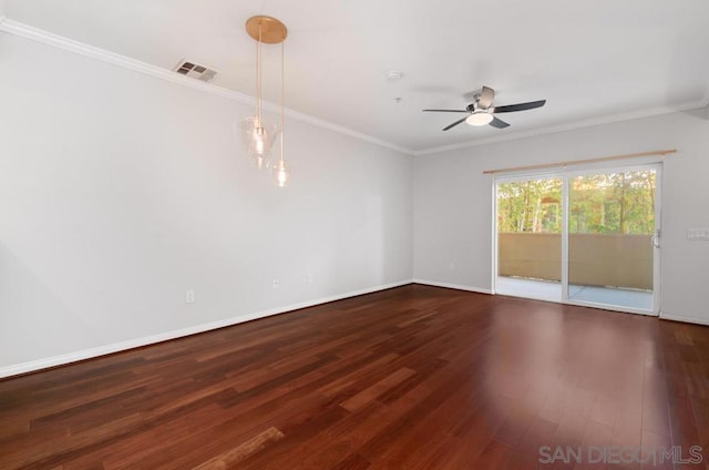 unfurnished room featuring ceiling fan, dark hardwood / wood-style flooring, and ornamental molding