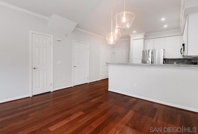 interior space with dark wood-type flooring and crown molding