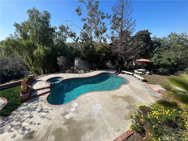 6966 Ranch View Rd, Riverside, CA 92506 - view of pool featuring a patio, a pool with connected hot tub, and view of scattered trees