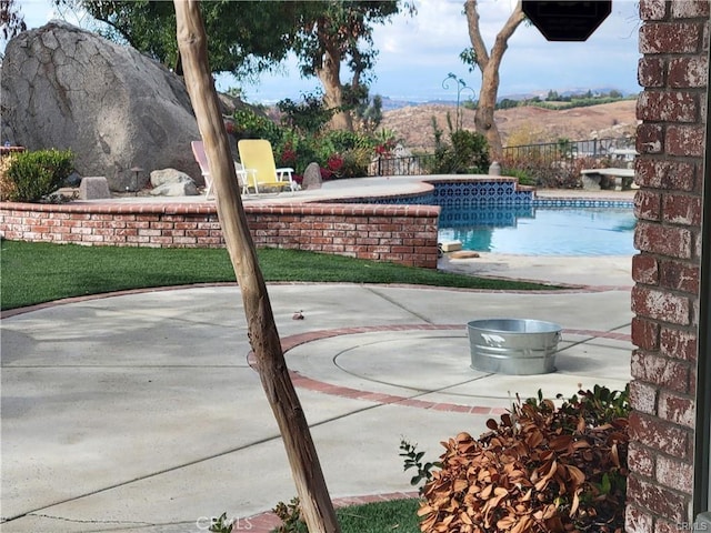 exterior space with a fenced in pool