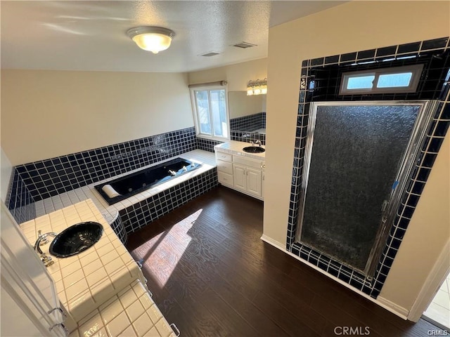 6966 Ranch View Rd, Riverside, CA 92506 - full bath with a garden tub, a shower stall, vanity, and wood finished floors