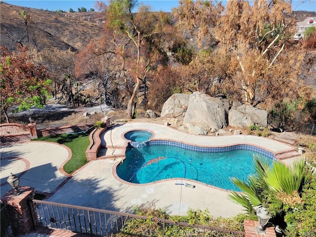 6966 Ranch View Rd, Riverside, CA 92506 - view of pool featuring a pool with connected hot tub, a mountain view, and a patio