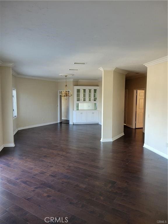 6966 Ranch View Rd, Riverside, CA 92506 - unfurnished living room featuring a chandelier, dark wood-style floors, and crown molding