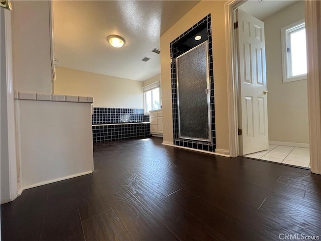 6966 Ranch View Rd, Riverside, CA 92506 - unfurnished living room with wood finished floors and tile walls