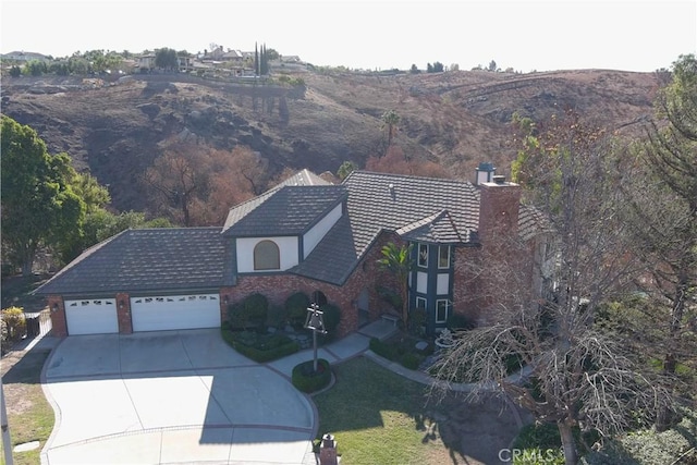 view of front of home featuring a garage and a mountain view