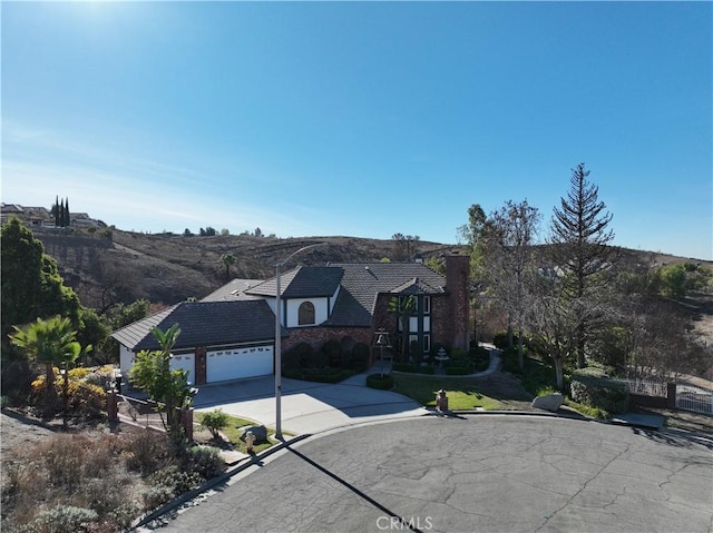 view of front of home featuring a garage and a mountain view