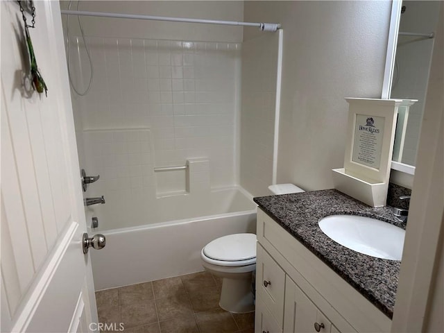 full bathroom featuring toilet, tile patterned flooring, washtub / shower combination, and vanity