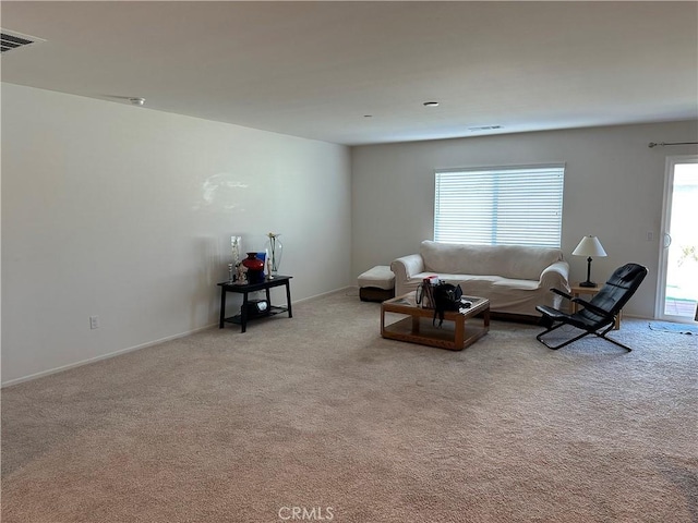 unfurnished living room featuring light colored carpet