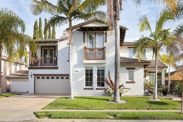 mediterranean / spanish house with a balcony, a front lawn, and a garage