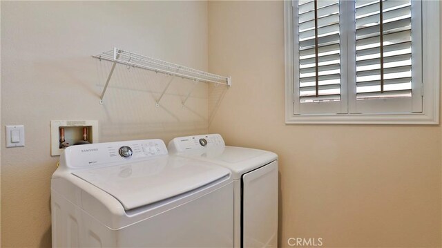 washroom featuring independent washer and dryer