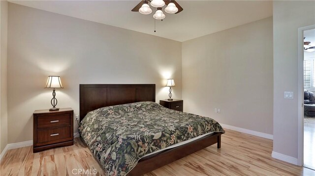 bedroom featuring ceiling fan and light hardwood / wood-style floors