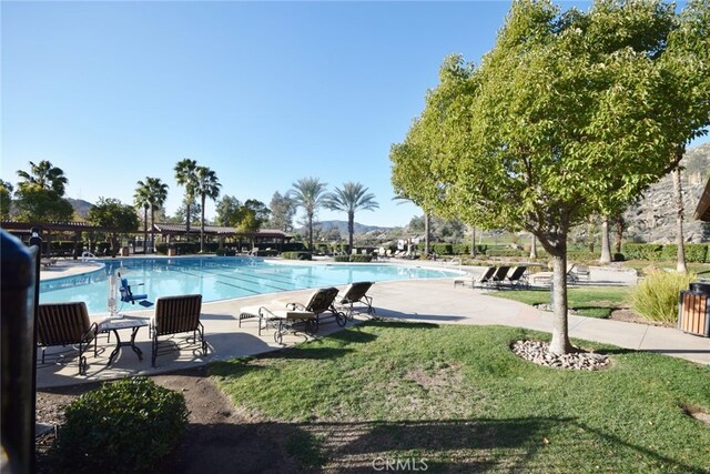 view of swimming pool with a patio area