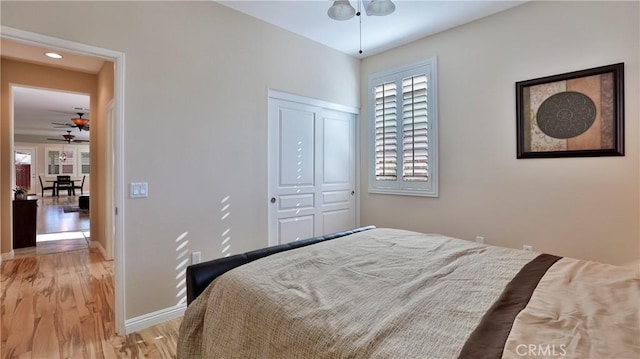 bedroom featuring a closet and light hardwood / wood-style flooring