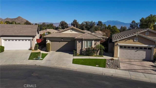 view of front of home featuring a garage and a mountain view