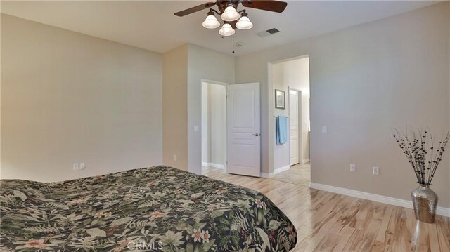 bedroom with ceiling fan and light hardwood / wood-style flooring