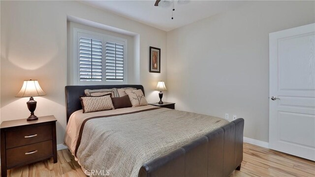 bedroom featuring ceiling fan and light wood-type flooring