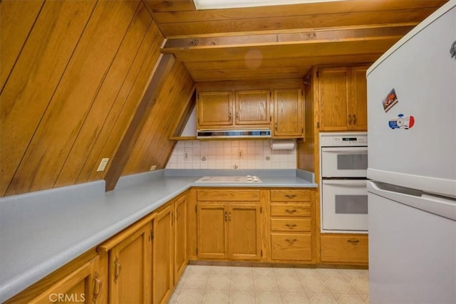 kitchen with backsplash, white appliances, and ventilation hood