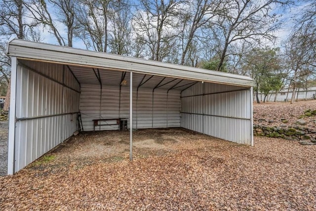 view of outbuilding with a carport