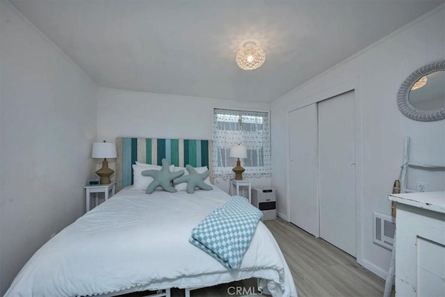 bedroom with light hardwood / wood-style flooring