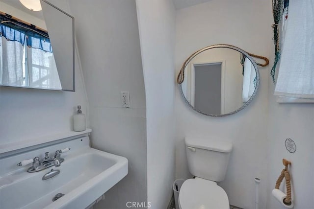 bathroom featuring sink and toilet