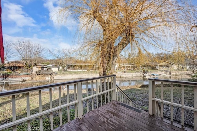 wooden terrace with a water view