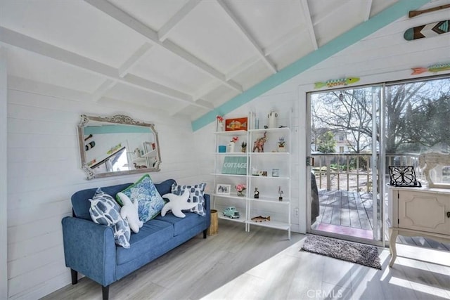 sitting room featuring beam ceiling, wood-type flooring, wood walls, and coffered ceiling