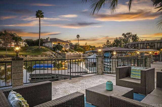 patio terrace at dusk with a balcony