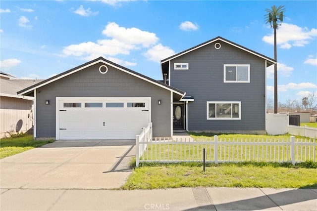 traditional-style home featuring an attached garage, driveway, a fenced front yard, and a front lawn