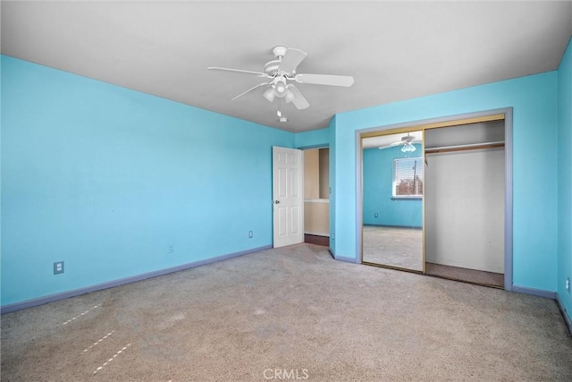 unfurnished bedroom featuring a closet, carpet flooring, ceiling fan, and baseboards