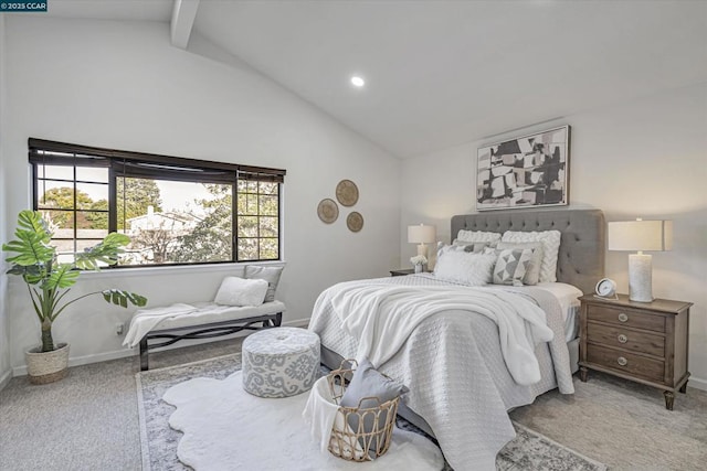 carpeted bedroom with lofted ceiling with beams