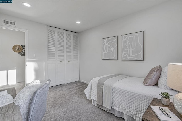 carpeted bedroom with a closet