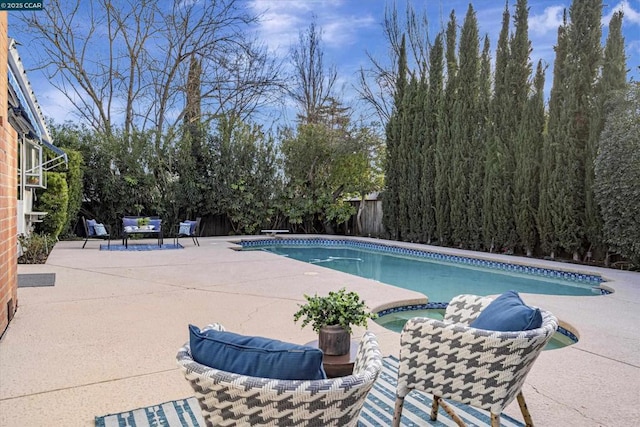 view of swimming pool featuring a patio