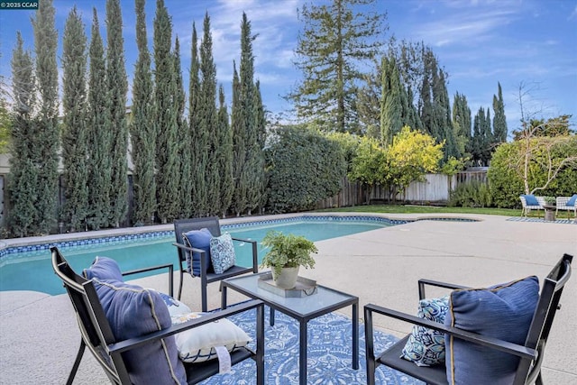 view of pool featuring a patio