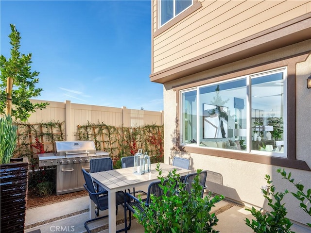 view of patio with area for grilling and exterior kitchen