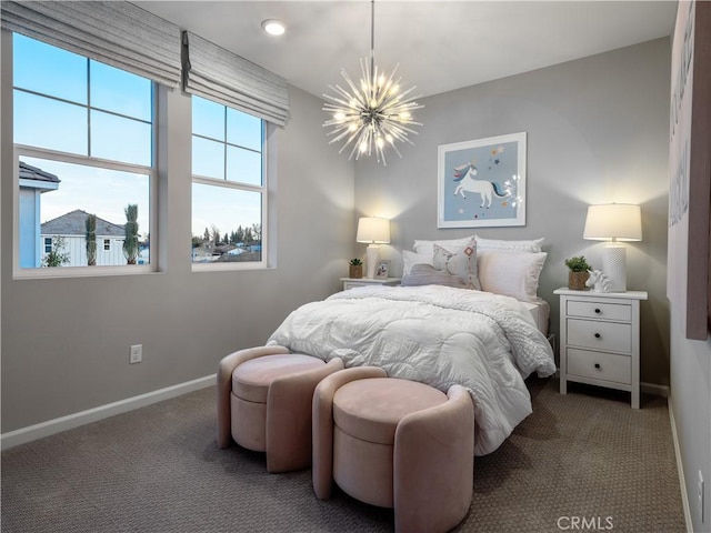 carpeted bedroom with multiple windows and a chandelier