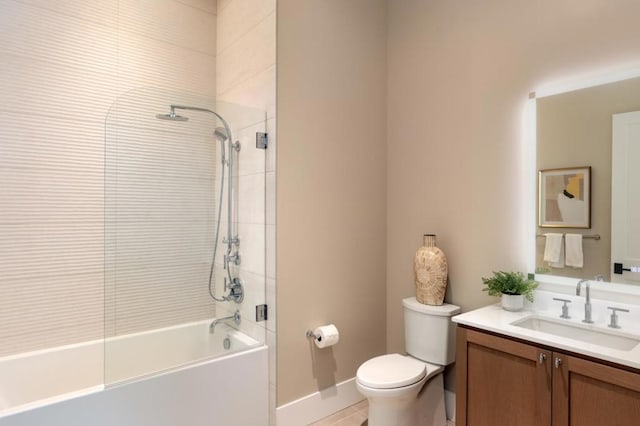 full bathroom with tile patterned floors, toilet, vanity, and tiled shower / bath combo