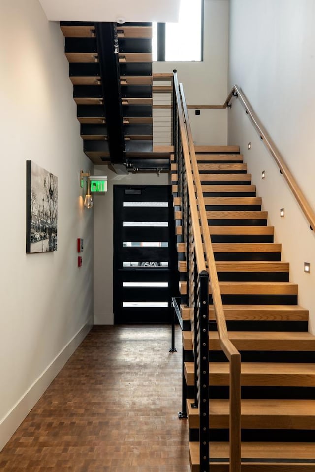 staircase featuring hardwood / wood-style flooring