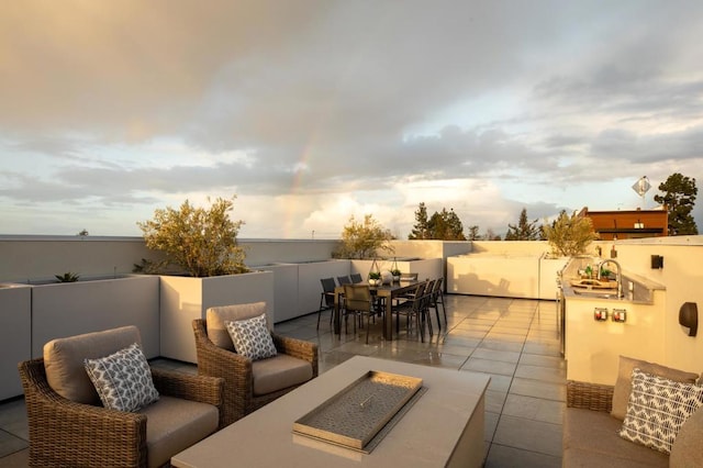 view of patio with a fire pit